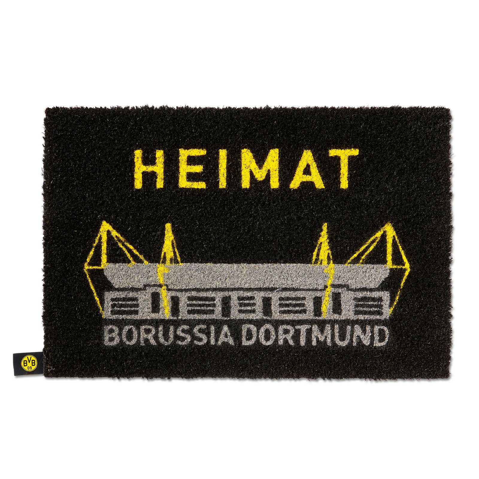 Vorderansicht der schwarzgelben BVB-Fußmatte mit SIGNAL IDUNA PARK, gelbem „HEIMAT“-Schriftzug und BVB-Emblem am linken Rand.
