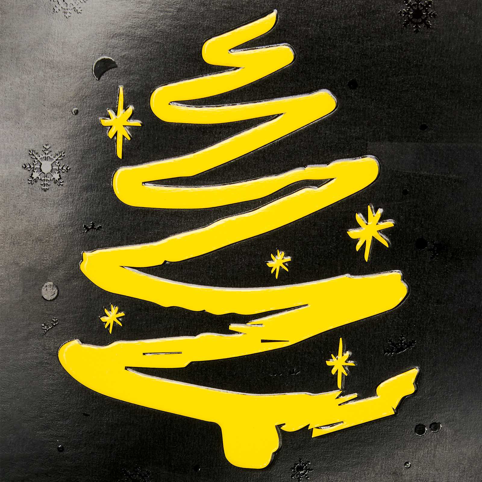 Detailansicht der BVB Weihnachtsgrußkarte mit einem stilisierten gelben Weihnachtsbaum auf schwarzem Hintergrund und Schneeflockenmotiven.