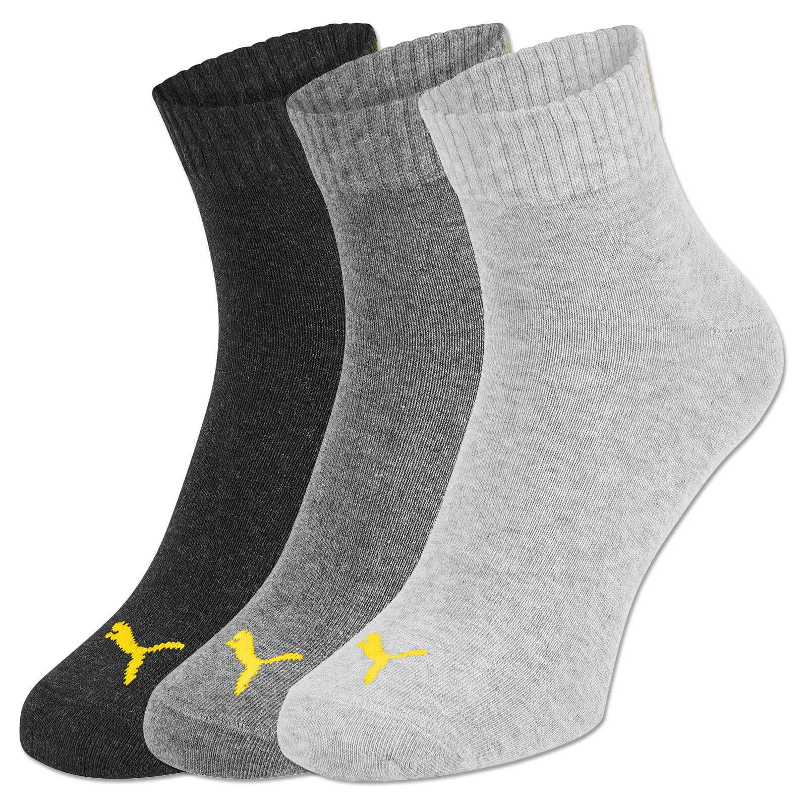 Vorderansicht des BVB-Viertel Socken (Puma) 3er Packs in Schwarz, Grau und Hellgrau mit gelbem Puma-Logo auf dem Fuß.