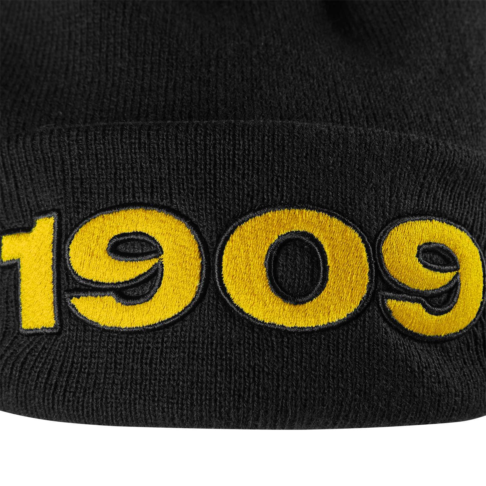 Detailansicht der schwarzgelben BVB Beanie New Era 1909 mit großer gelber "1909"-Stickerei auf der Vorderseite.