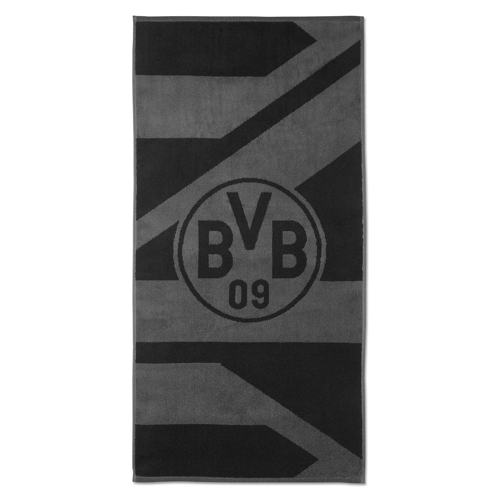 Frontalansicht des BVB Handtuchs grau/schwarz 50x100 cm mit großem BVB-Emblem und stilisierten Streifenmuster auf der Vorderseite.