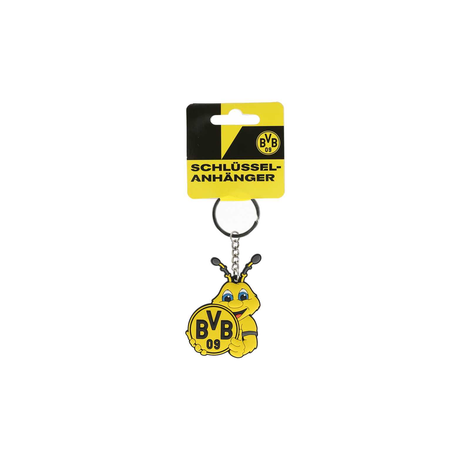 Frontansicht des BVB Emma Schlüsselanhängers mit EMMA-Motiv, der ein rundes BVB-Emblem in schwarzgelb hält. Verpackung mit BVB 09-Logo sichtbar.