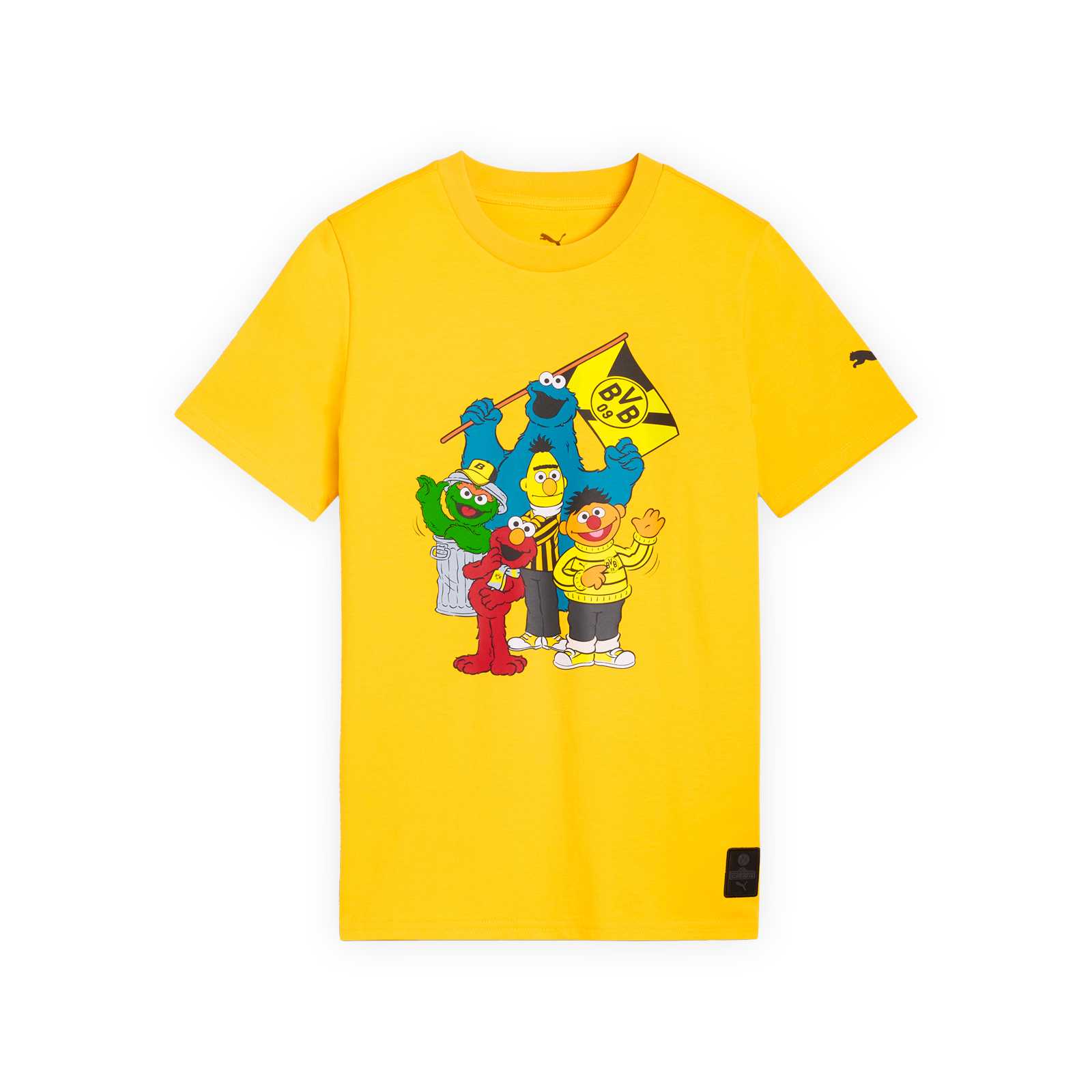 Vorderansicht vom gelben T-Shirt mit Ernie, Bert, Elmo, Oskar und dem Krümelmonster auf der Brust. Das Krümelmonster trägt eine BVB-Fahne.